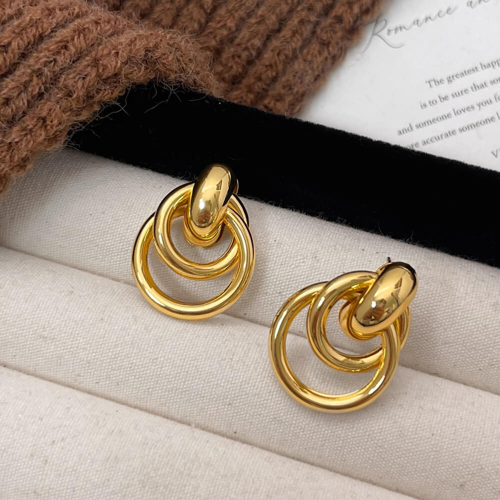 aretes-acero-verso-dorado